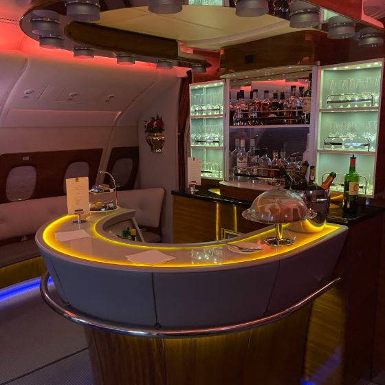 The warmly lit onboard bar in Emirates business class